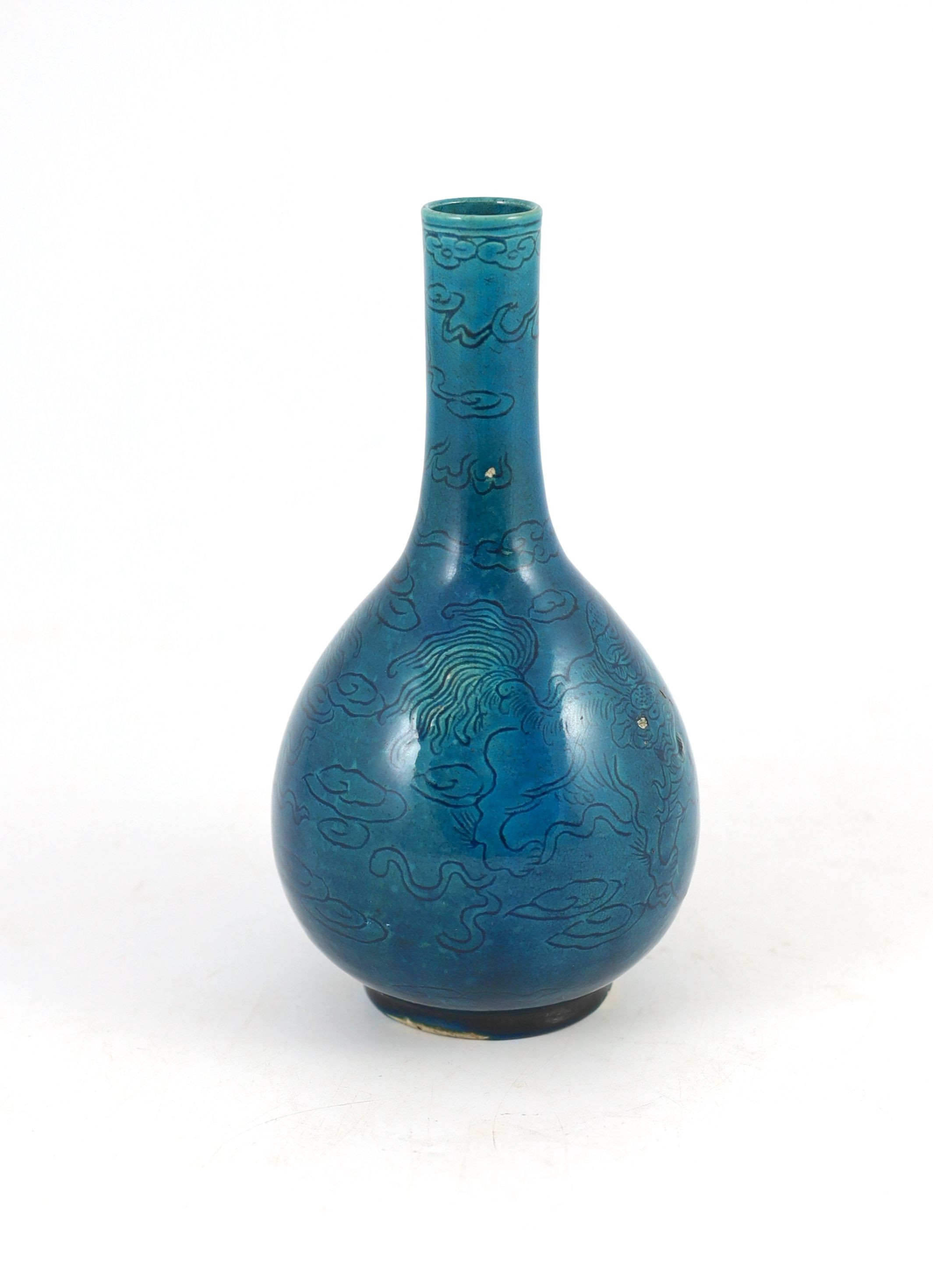 A Chinese turquoise glazed sgraffito bottle vase, 19th century, 21 cm high